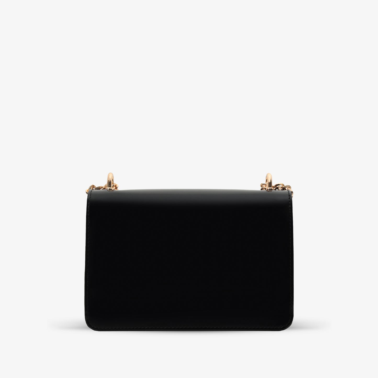 El bolso de mano Ferrara de piel de charol negra