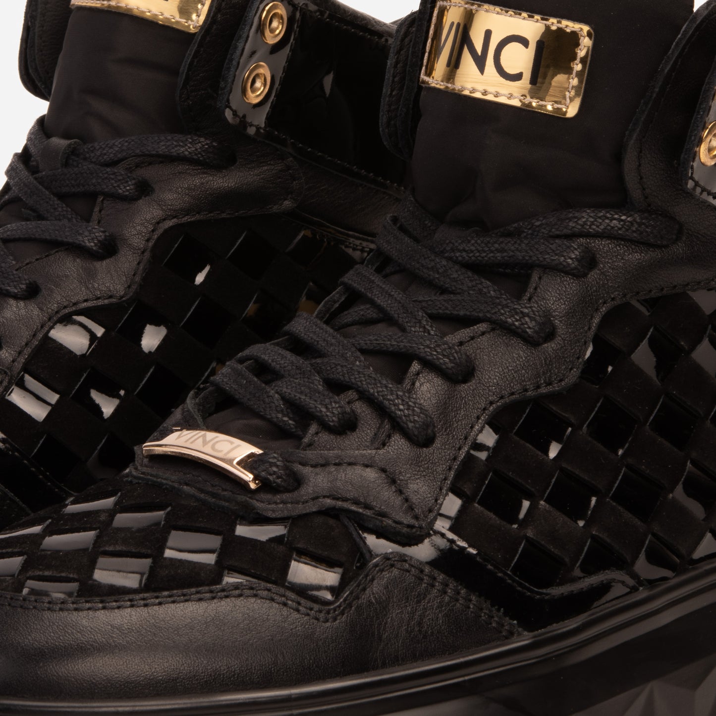 Zapatillas altas de cuero tejido en negro y dorado Eugene para hombre