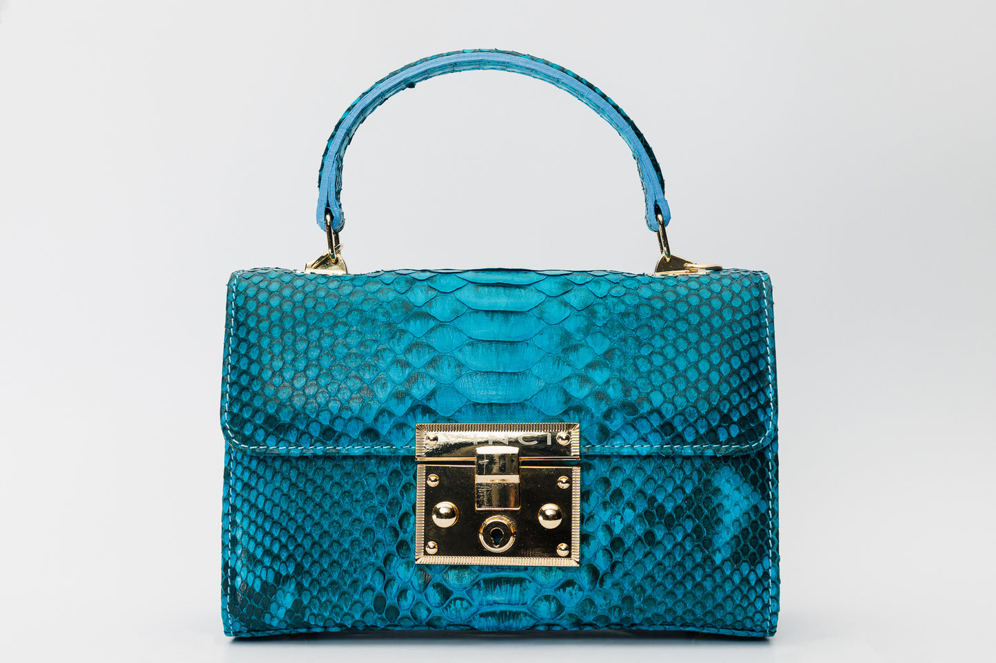 Bolso de mano de piel color turquesa The Queen
