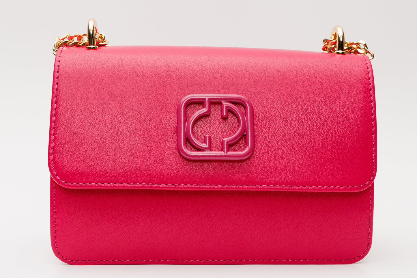 El bolso de mano de piel fucsia Maneadero
