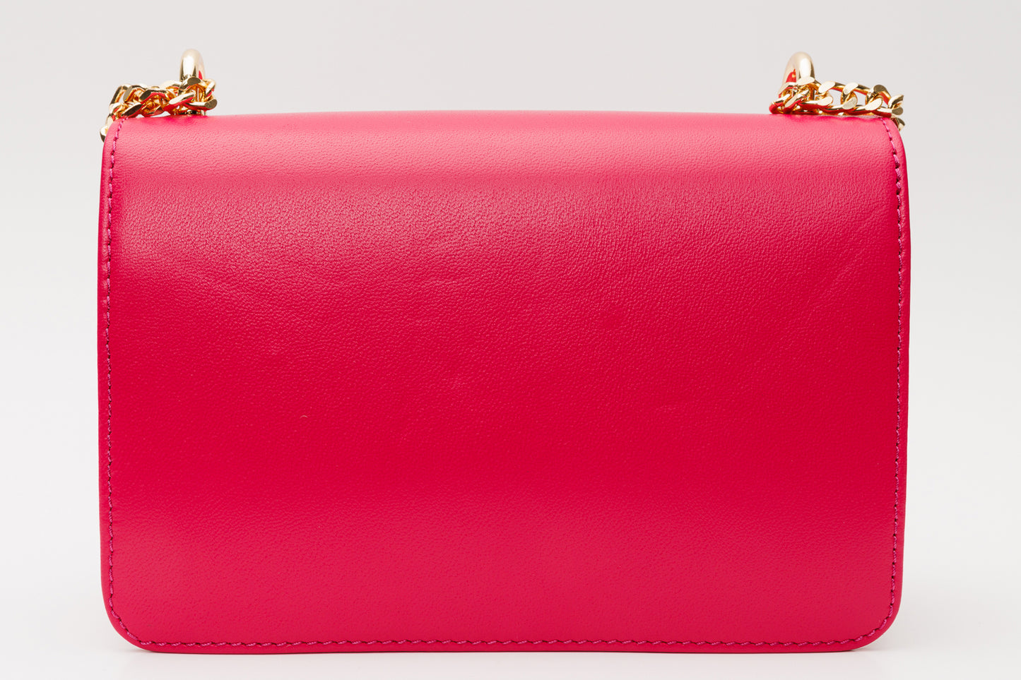 El bolso de mano de piel fucsia Maneadero