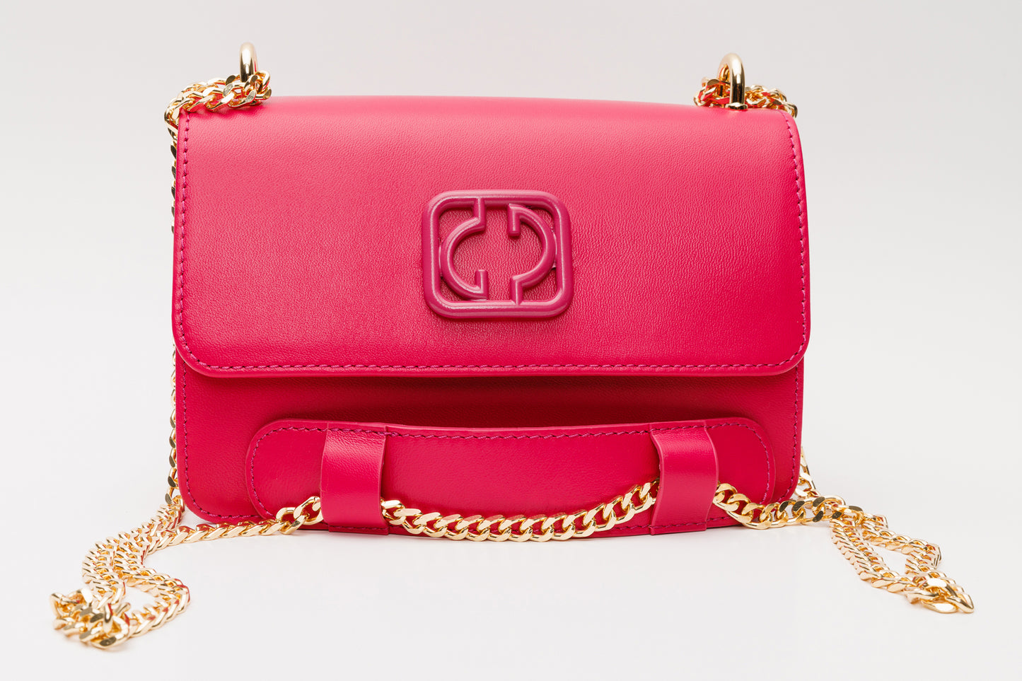 El bolso de mano de piel fucsia Maneadero