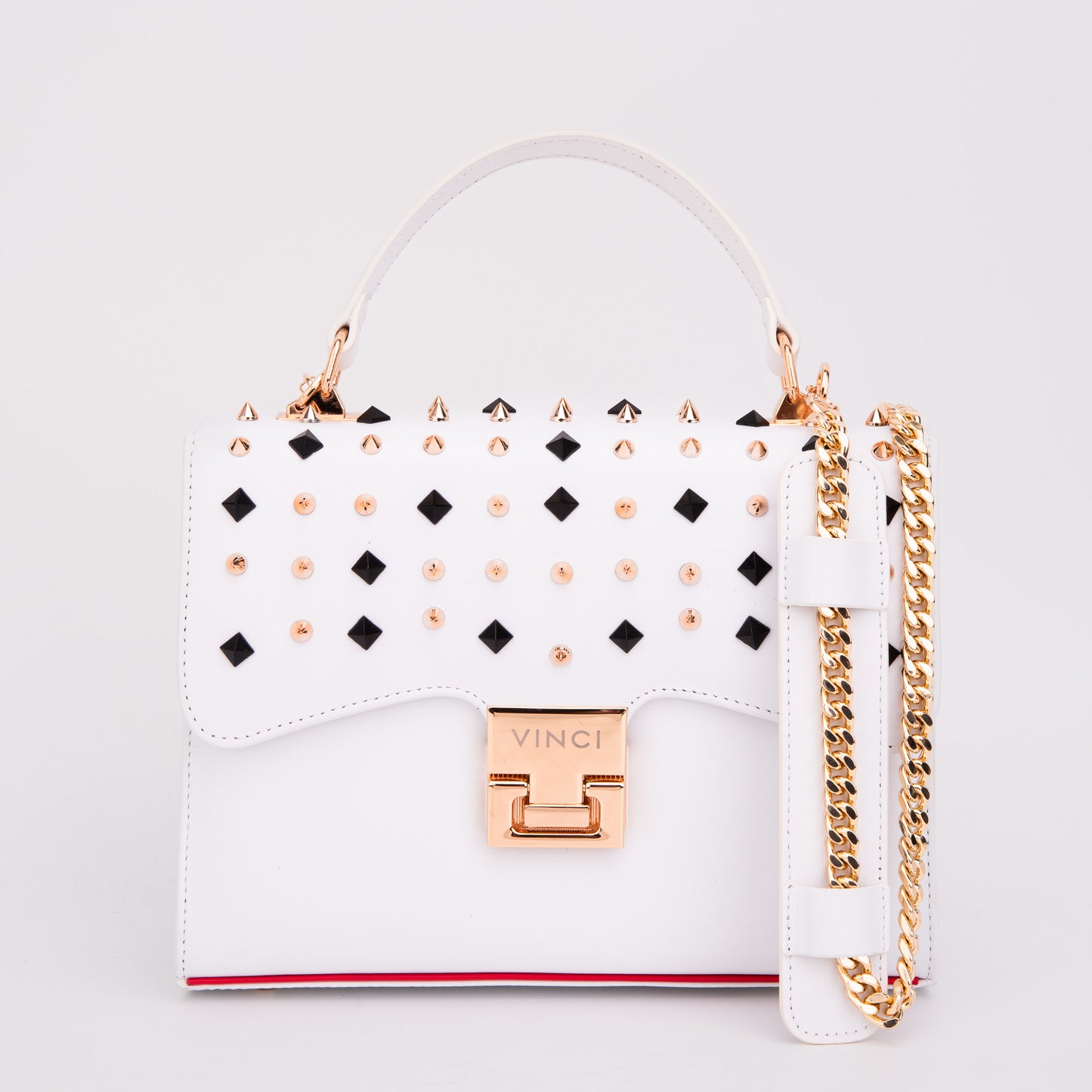 El bolso de mano Infanta de piel con pinchos blancos 