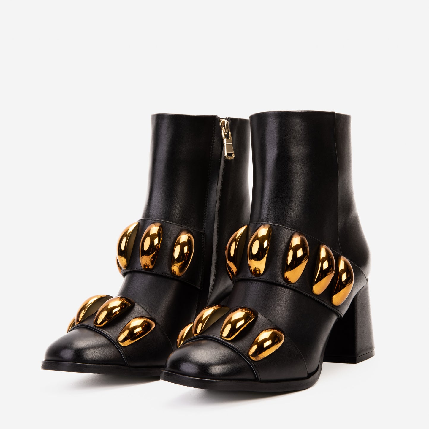 Las botas de mujer Eclipse de cuero negro y dorado con tacón bloque