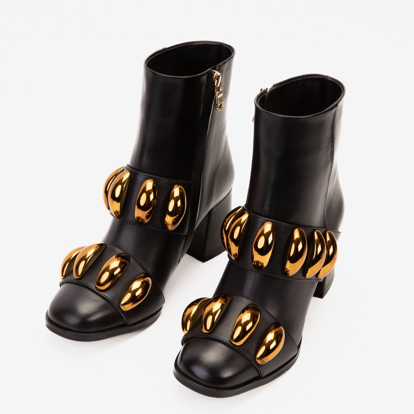 Las botas de mujer Eclipse de cuero negro y dorado con tacón bloque